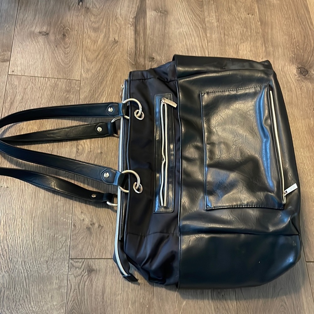 beis diaper bag. Lightly used condition. One zipper has a snag.